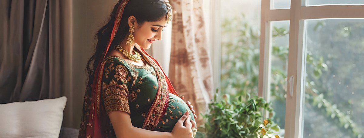 indian young pregnant woman holding her baby bump